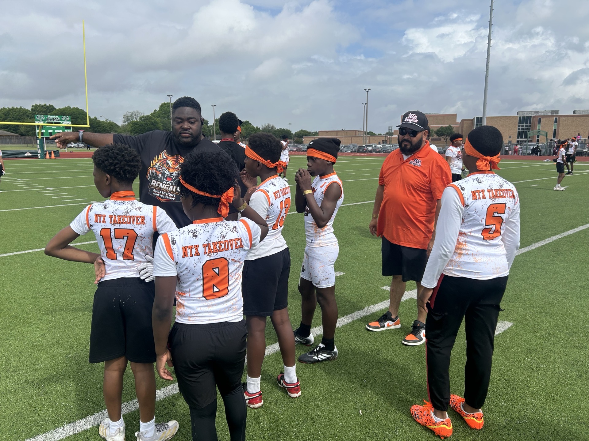 NTX Bengals players with coaches during youth football practice
