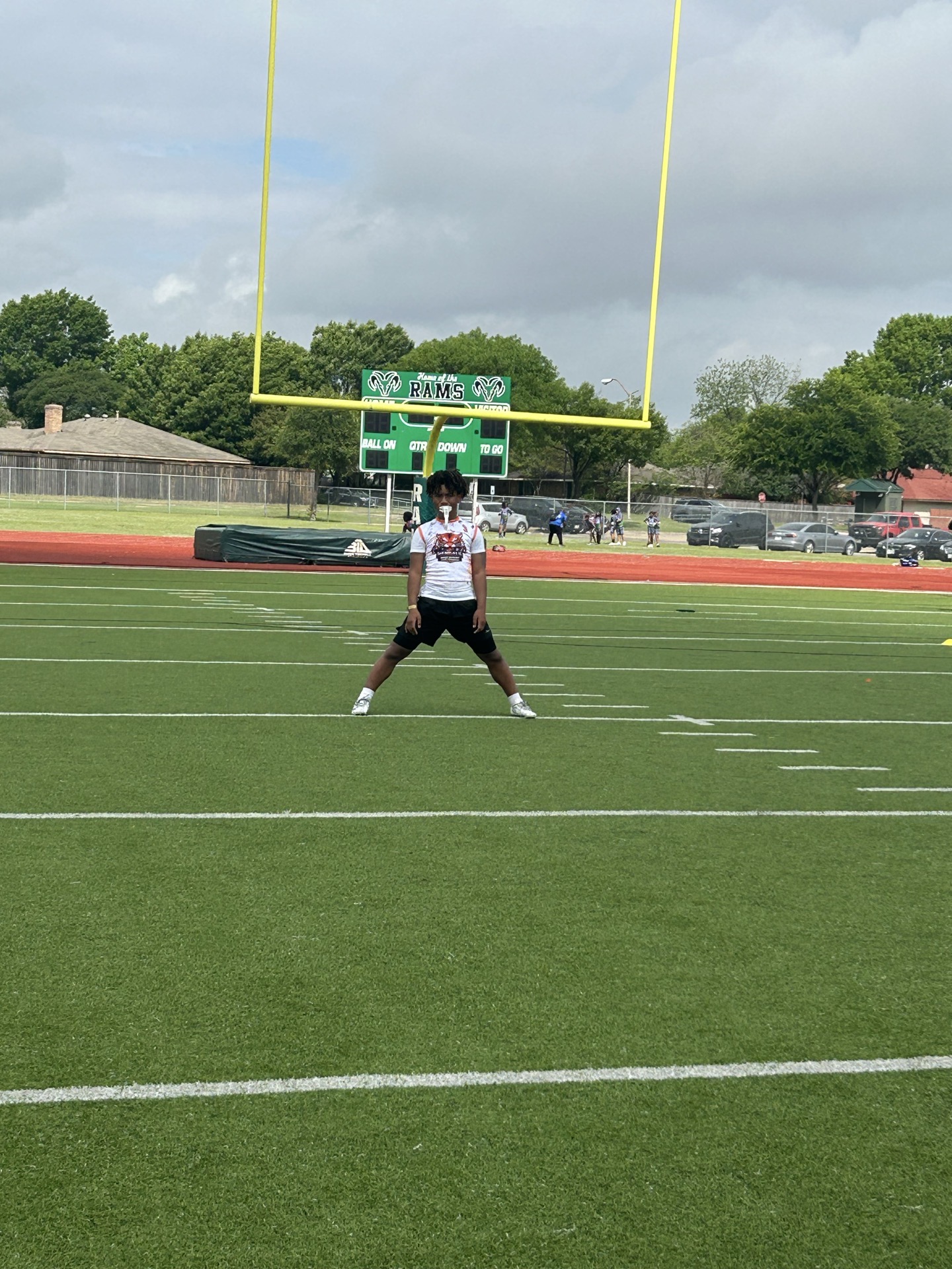 NTX Bengals player stretching and warming up on the field