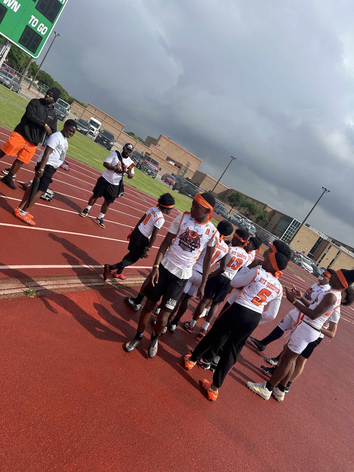 NTX Bengals players and coaches on the track after practice